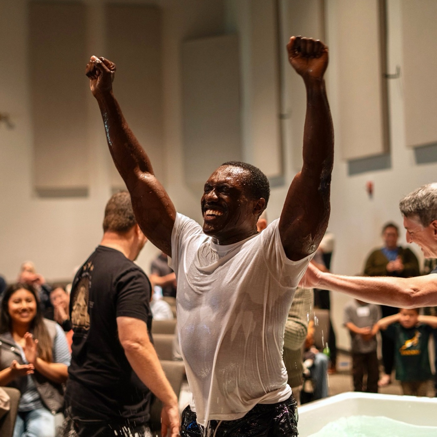 A man celebrating after his baptism