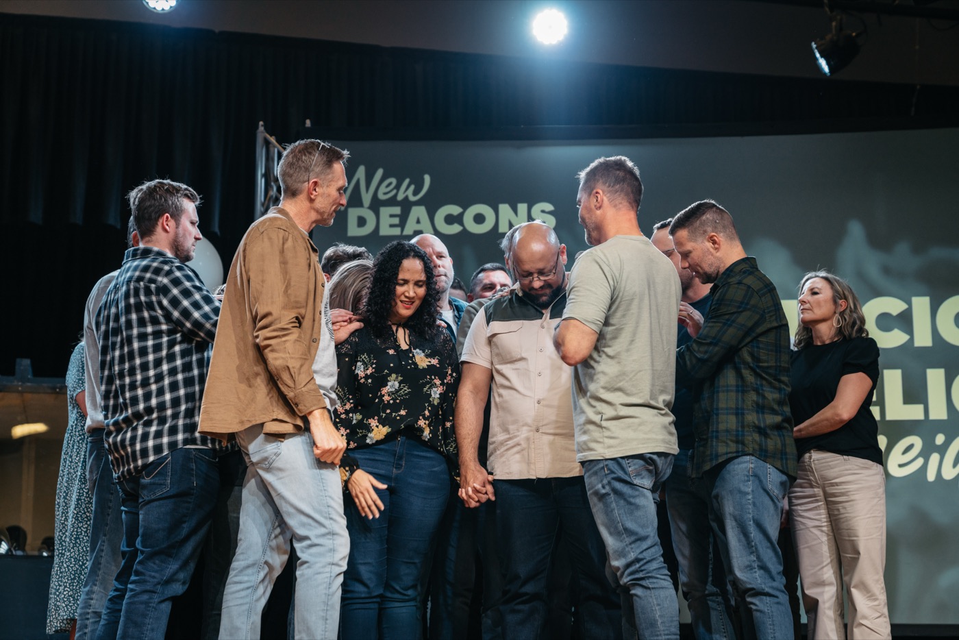 A church planting team praying together
